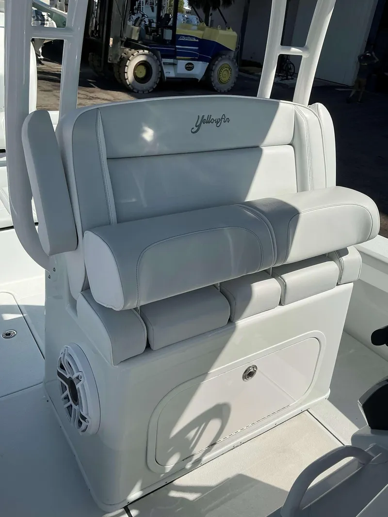 Slide: The Image of 2023 Yellowfin 26 CC Hybrid boat seat with storage and speaker. - 19