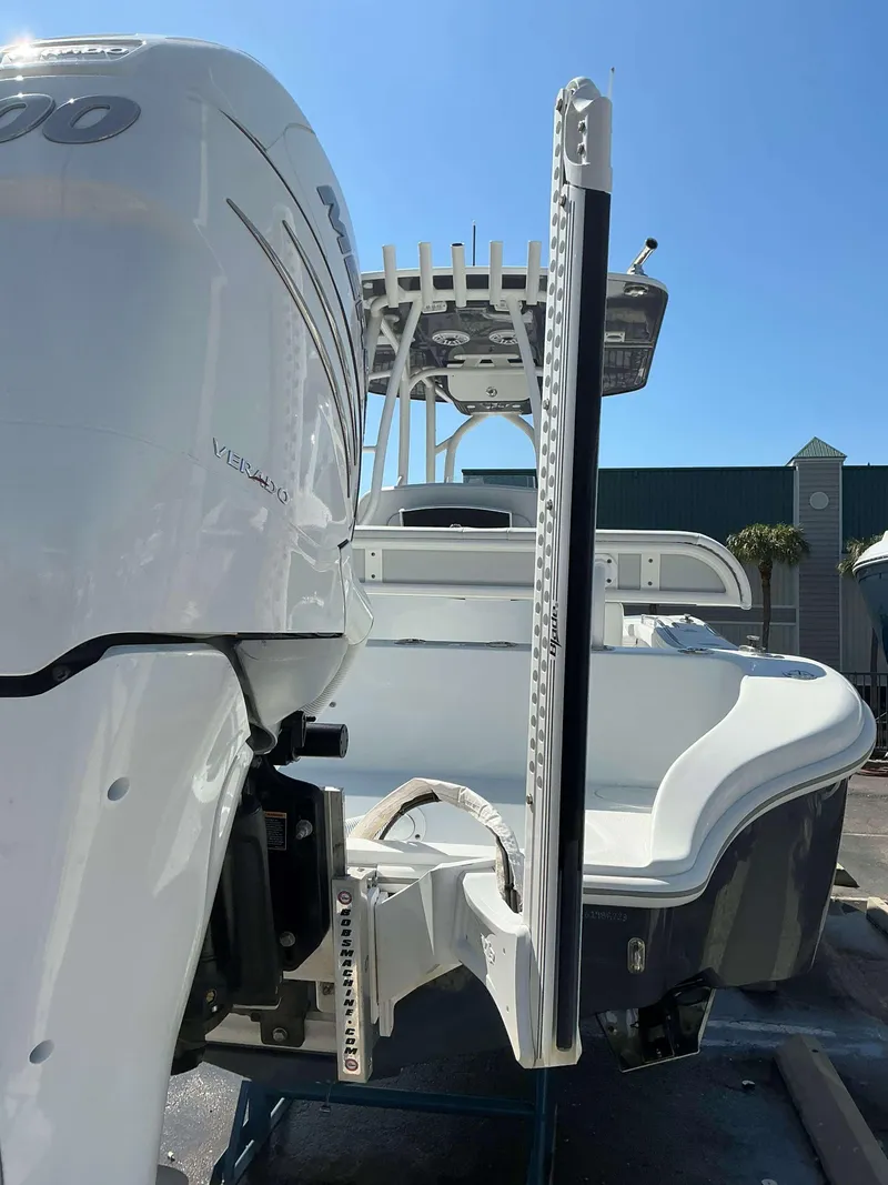 Slide: The Image of 2023 Yellowfin 26 CC Hybrid boat with powerful engine, viewed from the rear. - 3