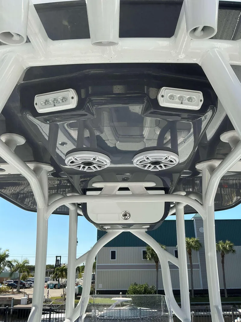 Slide: The Image of 2023 Yellowfin 26 CC Hybrid boat roof with speakers and lights, showcasing modern design. - 4