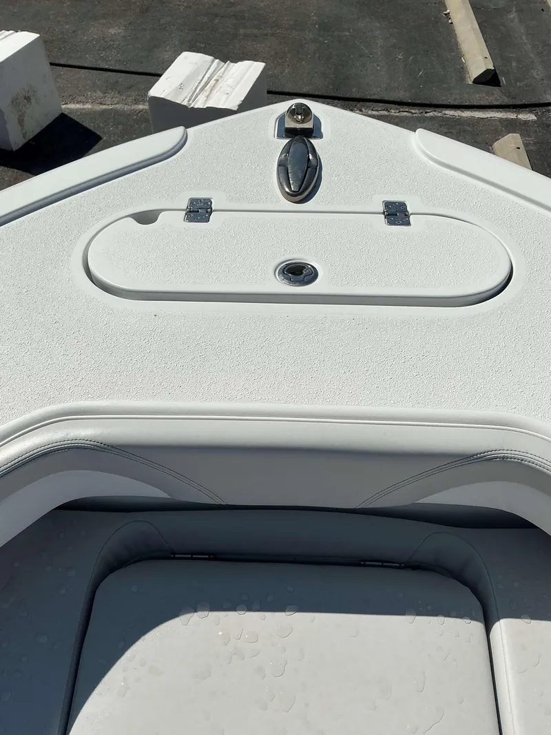 Slide: The Image of 2023 Yellowfin 26 CC Hybrid boat deck with storage compartment. - 8