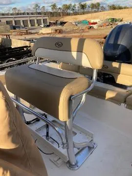 Slide: The Image of 2020 Key West 189 FS boat seat with beige upholstery and metal frame. - 4