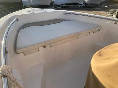 Slide: The Image of 2020 Key West 189 FS boat interior with cushioned seating and storage. - 5