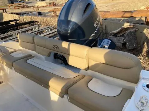 Slide: The Image of 2020 Key West 189 FS boat with tan seating and outboard motor. - 6