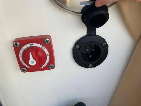 Slide: The Image of 2020 Key West 189 FS boat battery switch and power outlet. - 7