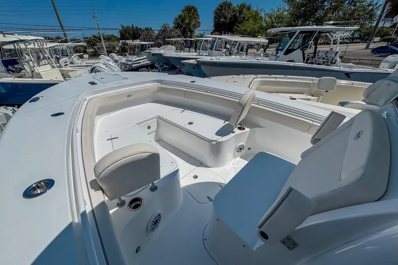 Slide: The Image of 2025 Sea Hunt Gamefish 28 FS boat interior with seating and storage compartments. - 7