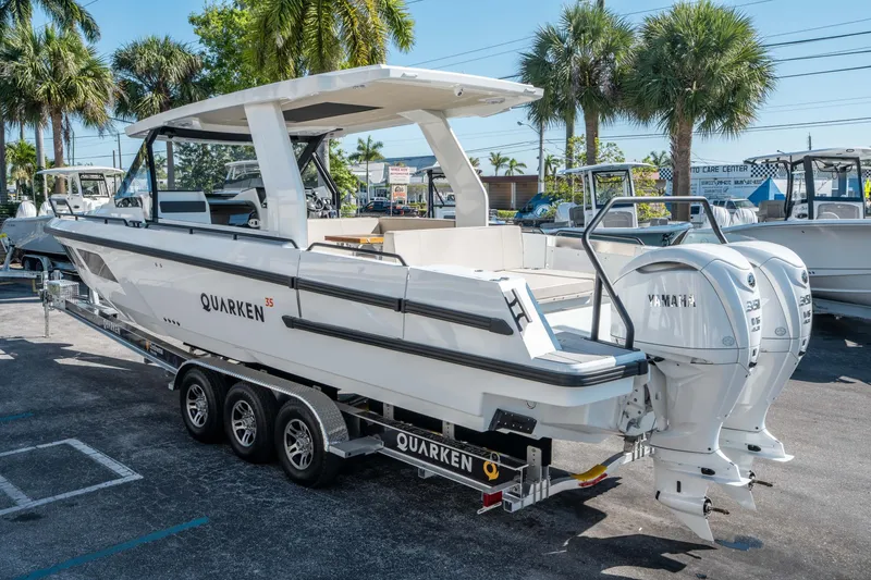 Slide: The Image of 2025 Quarken 35 Sport Tourer boat with dual Yamaha engines on a trailer. - 4
