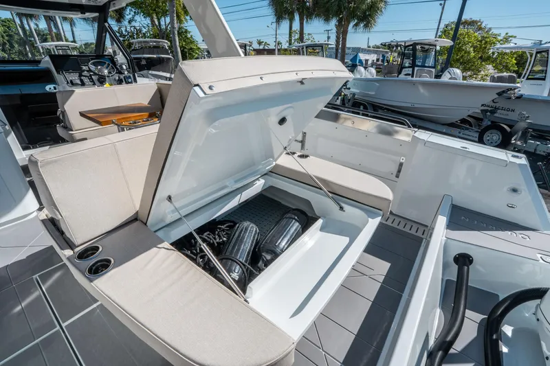 Slide: The Image of 2025 Quarken 35 Sport Tourer boat interior with open engine compartment, showcasing modern design. - 11