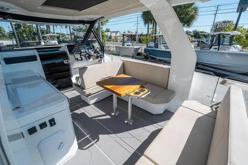 Slide: The Image of Interior of 2025 Quarken 35 Sport Tourer, featuring seating and a wooden table. - 14