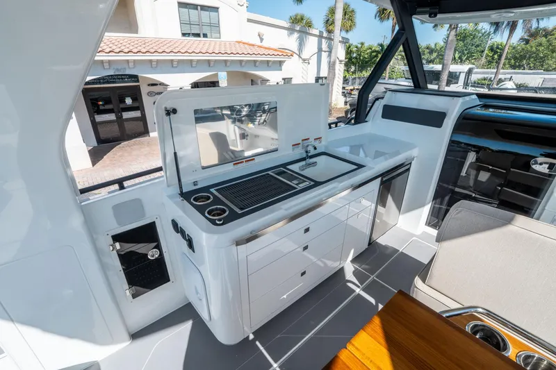 Slide: The Image of Interior of 2025 Quarken 35 Sport Tourer featuring a sleek kitchenette with modern amenities. - 20