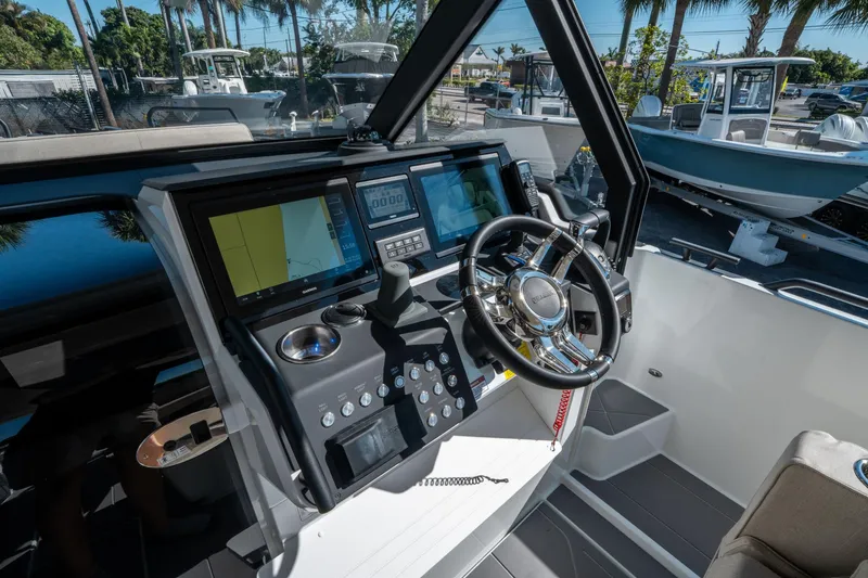Slide: The Image of Cockpit of 2025 Quarken 35 Sport Tourer with advanced navigation systems and steering wheel. - 25