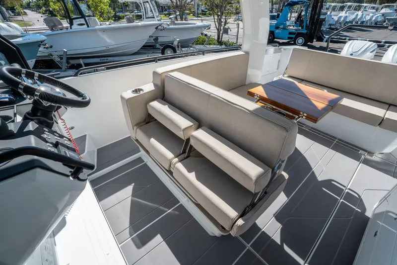 Slide: The Image of 2025 Quarken 35 Sport Tourer interior with seating and wooden table, showcasing modern design. - 26