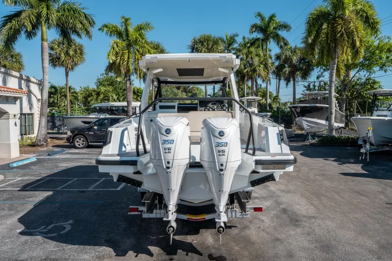 Slide: The Image of 2025 Quarken 35 Sport Tourer with dual 350 V6 engines, parked outdoors. - 3