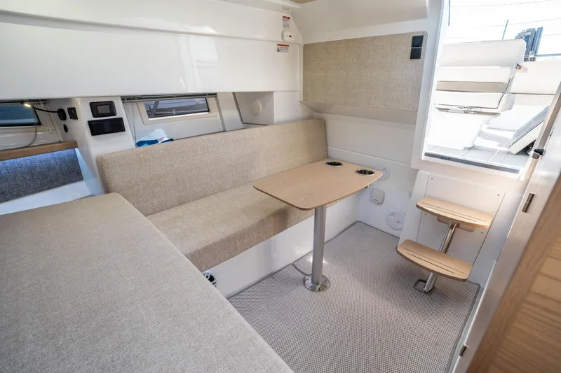 Slide: The Image of Interior of 2025 Quarken 35 Sport Tourer, featuring cozy seating and a compact table. - 36