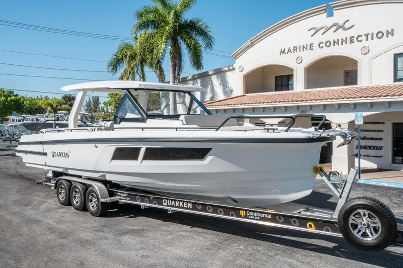 Slide: The Image of 2025 Quarken 35 Sport Tourer boat on trailer at Marine Connection dealership. - 8