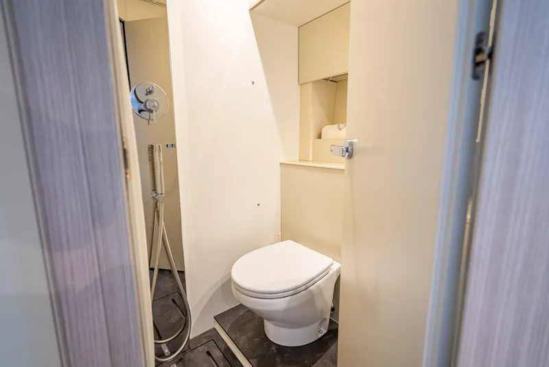 Slide: The Image of 2021 Cranchi M44 yacht bathroom with modern fixtures and compact design. - 22