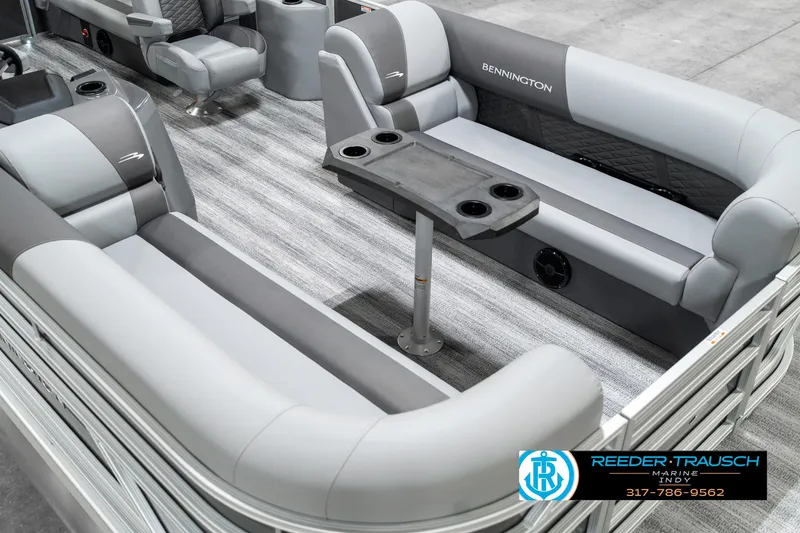 Slide: The Image of 2025 Bennington 21 SSR pontoon boat interior with gray seating and table. - 13