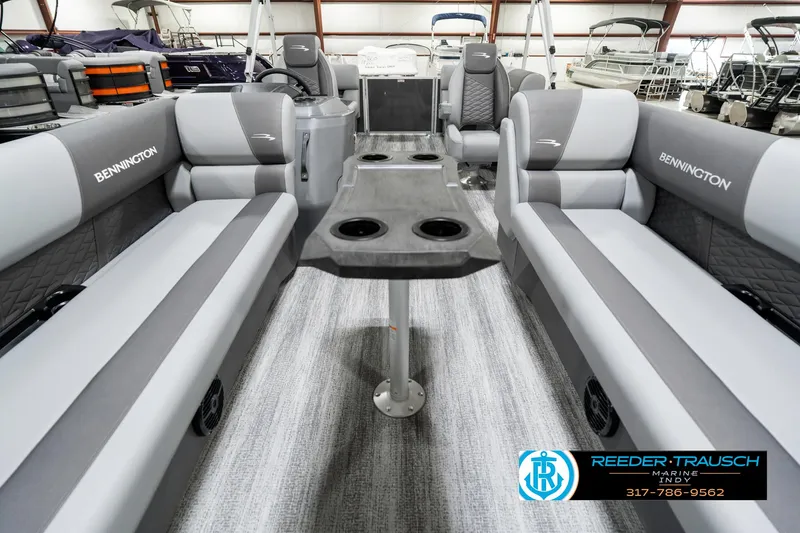 Slide: The Image of 2025 Bennington 21 SSR pontoon boat interior with gray seating and central table. - 16