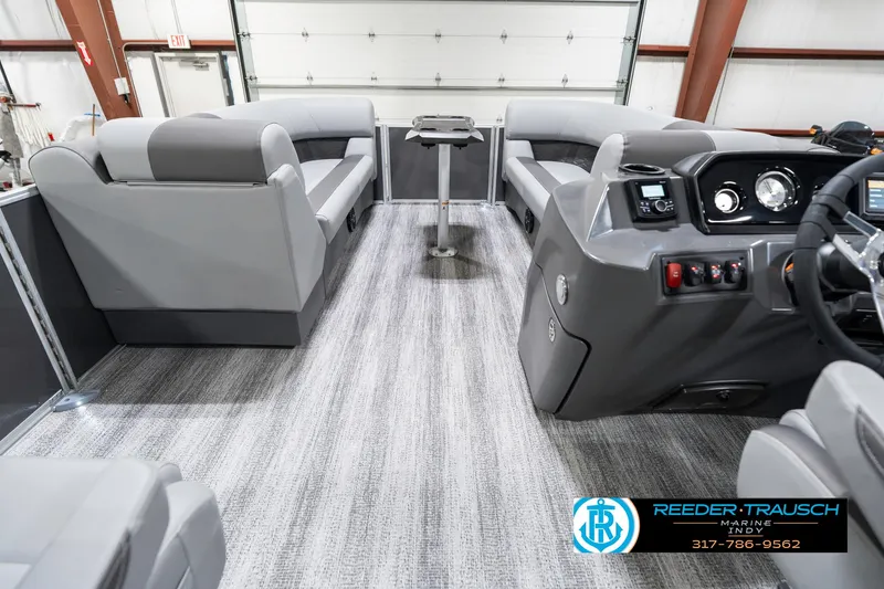 Slide: The Image of 2025 Bennington 21 SSR pontoon boat interior with modern seating and control panel. - 20