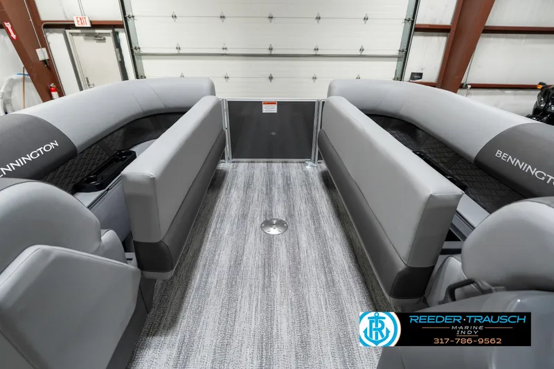 Slide: The Image of 2025 Bennington 21 SSR pontoon boat interior with gray seating and flooring. - 23