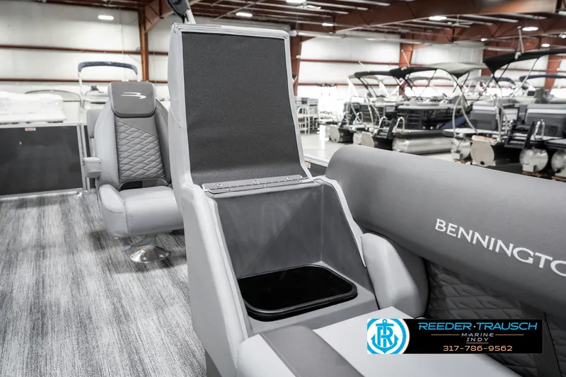 Slide: The Image of 2025 Bennington 21 SSR boat interior with open storage compartment in showroom. - 25