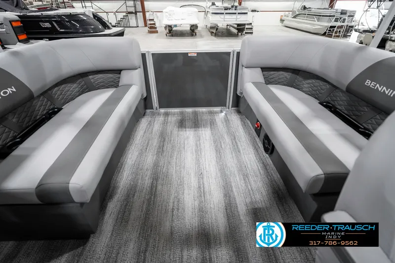 Slide: The Image of 2025 Bennington 21 SSR boat interior with gray seating and carpet flooring. - 26