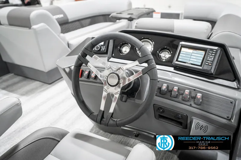 Slide: The Image of 2025 Bennington 21 SSR boat interior with modern steering wheel and dashboard controls. - 28