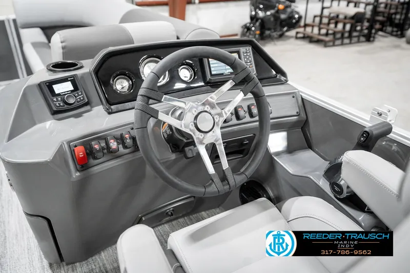Slide: The Image of 2025 Bennington 21 SSR boat dashboard with steering wheel and control panel. - 29