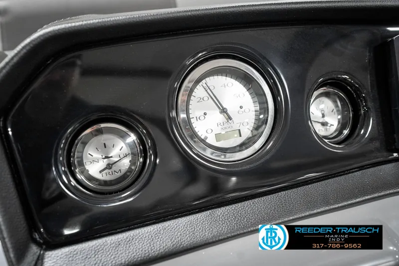 Slide: The Image of Dashboard gauges of 2025 Bennington 21 SSR boat, featuring RPM and speed indicators. - 33