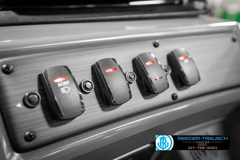 Slide: The Image of Control panel of 2025 Bennington 21 SSR boat with illuminated switches. - 35
