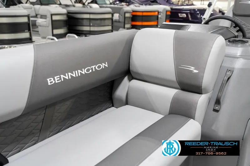 Slide: The Image of 2025 Bennington 21 SSR boat interior with gray seating and logo. - 38