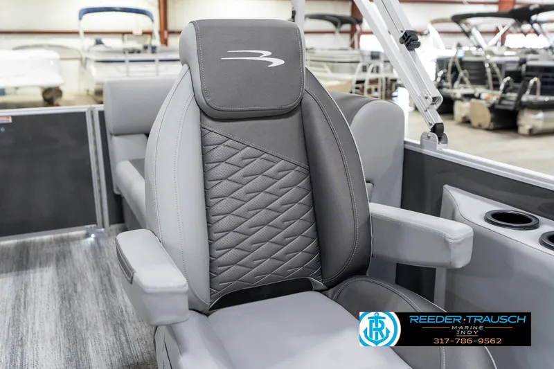 Slide: The Image of 2025 Bennington 21 SSR boat seat with quilted design and armrests in a showroom. - 40