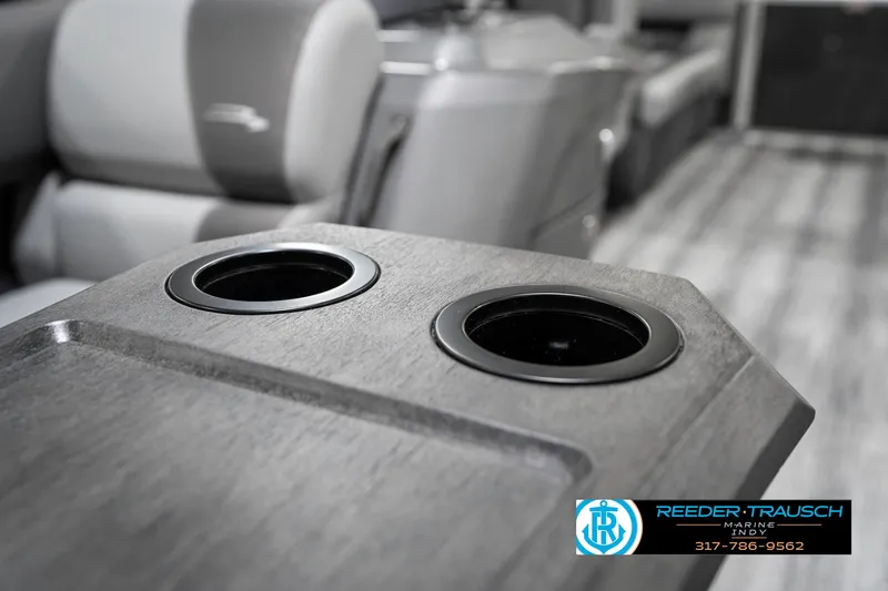 Slide: The Image of 2025 Bennington 21 SSR boat interior with dual cup holders and seating. - 44