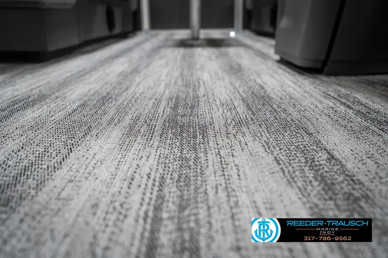Slide: The Image of Carpeted floor inside a 2025 Bennington 21 SSR boat, featuring a textured design. - 45