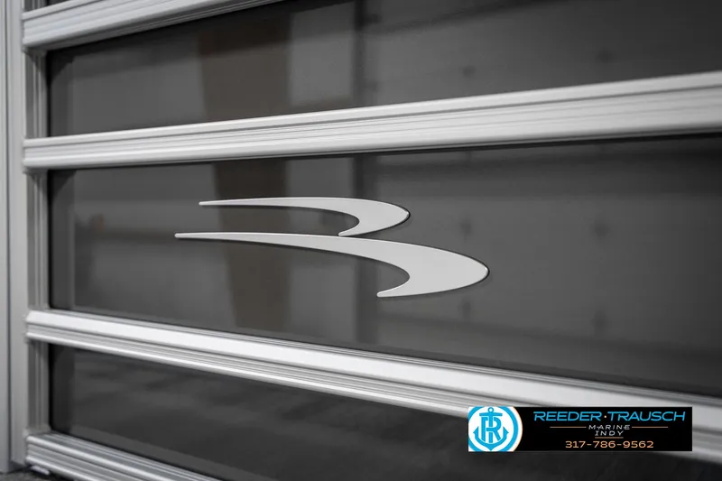 Slide: The Image of 2025 Bennington 21 SSR boat panel with logo and Reeder-Trausch Marine contact details. - 46