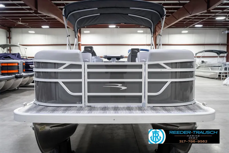 Slide: The Image of 2025 Bennington 21 SSR pontoon boat in showroom, front view. - 5