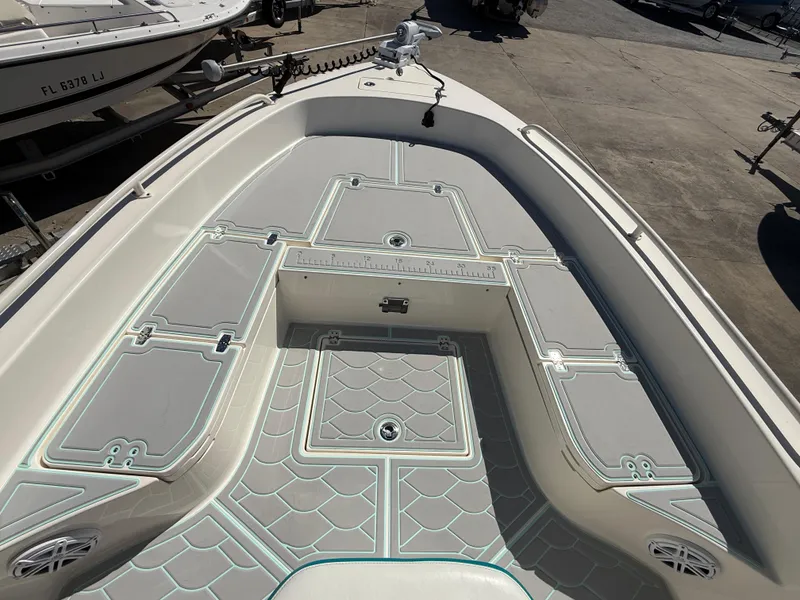 Slide: The Image of 2018 Pathfinder 2600 TRS boat deck with storage compartments and non-slip flooring. - 11