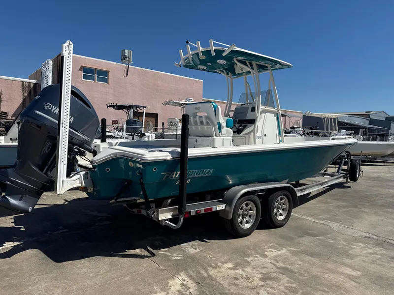 Slide: The Image of 2018 Pathfinder 2600 TRS boat on trailer with Yamaha outboard motor, parked outdoors. - 17