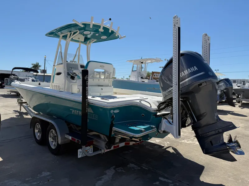 Slide: The Image of 2018 Pathfinder 2600 TRS boat with Yamaha engine on trailer, parked outdoors. - 3