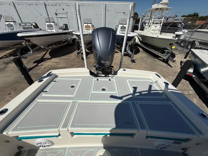 Slide: The Image of 2018 Pathfinder 2600 TRS boat with motor, docked among other boats. - 7