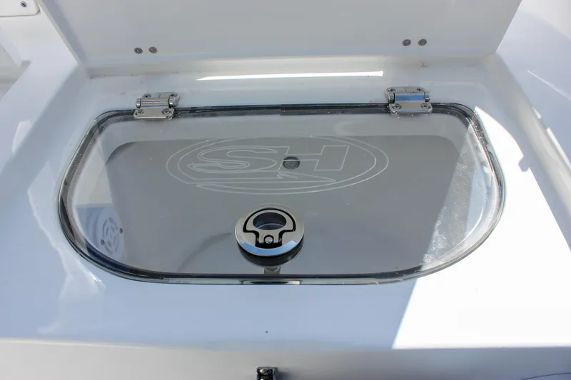 Slide: The Image of Livewell compartment on 2025 Sea Hunt Ultra 255 SE boat. - 19