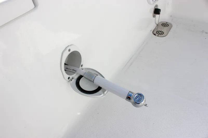 Slide: The Image of Sea Hunt Ultra 255 SE 2025 boat deck with hose outlet. - 21