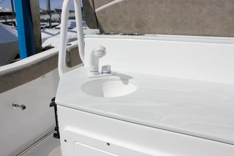 Slide: The Image of 2025 Sea Hunt Ultra 255 SE boat sink and faucet detail. - 26