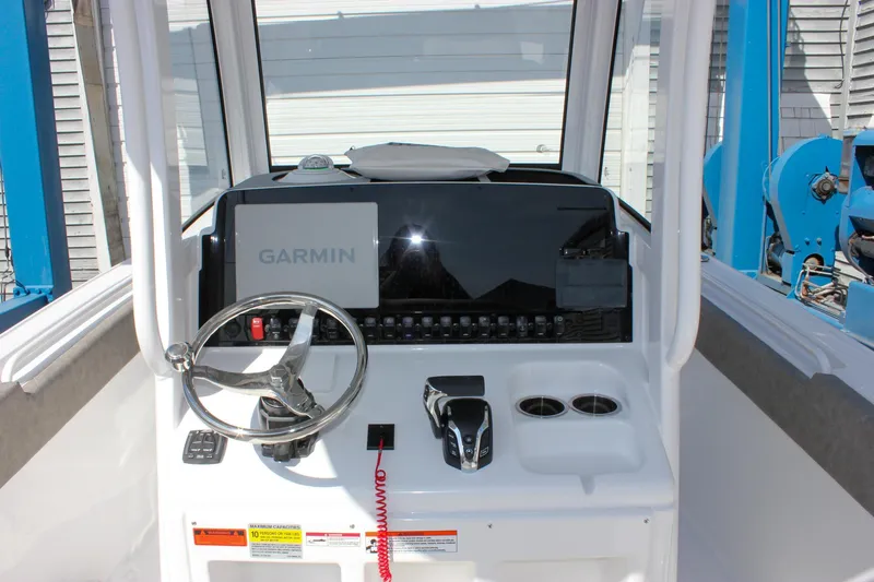 Slide: The Image of 2025 Sea Hunt Ultra 255 SE boat dashboard with Garmin navigation system. - 29