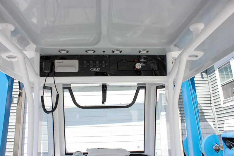 Slide: The Image of 2025 Sea Hunt Ultra 255 SE boat console with electronics and controls. - 30