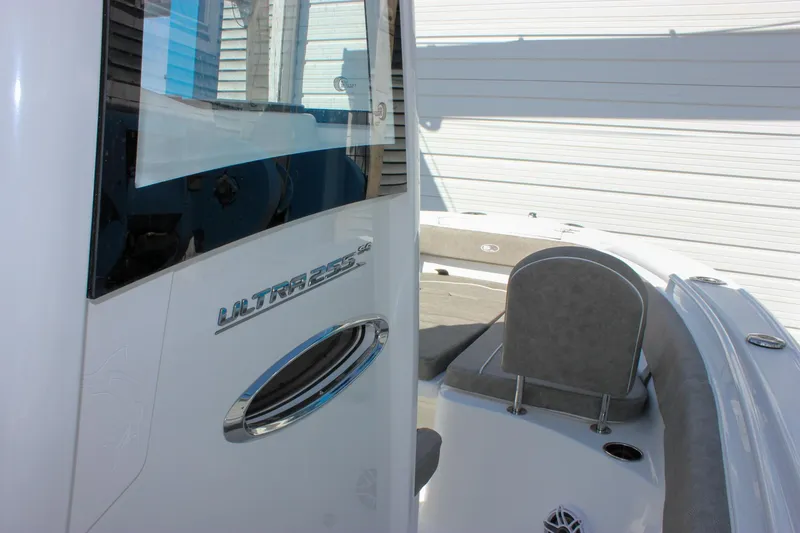Slide: The Image of 2025 Sea Hunt Ultra 255 SE boat, close-up of seating and console details. - 37