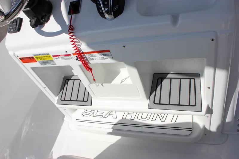 Slide: The Image of 2025 Sea Hunt Ultra 255 SE boat console with safety features and branding. - 38