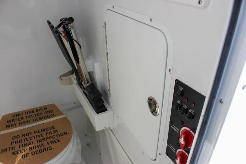 Slide: The Image of Interior of 2025 Sea Hunt Ultra 255 SE boat, featuring control panel and storage compartment. - 41