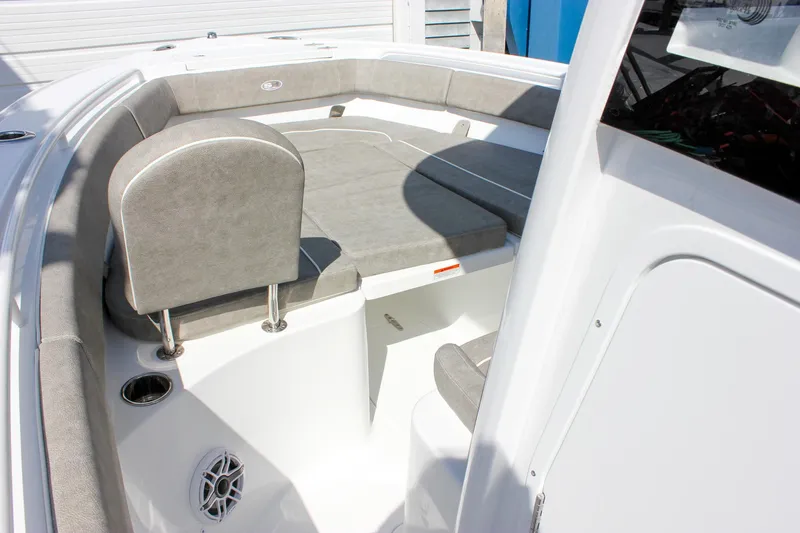 Slide: The Image of 2025 Sea Hunt Ultra 255 SE boat interior with cushioned seating and modern design. - 44