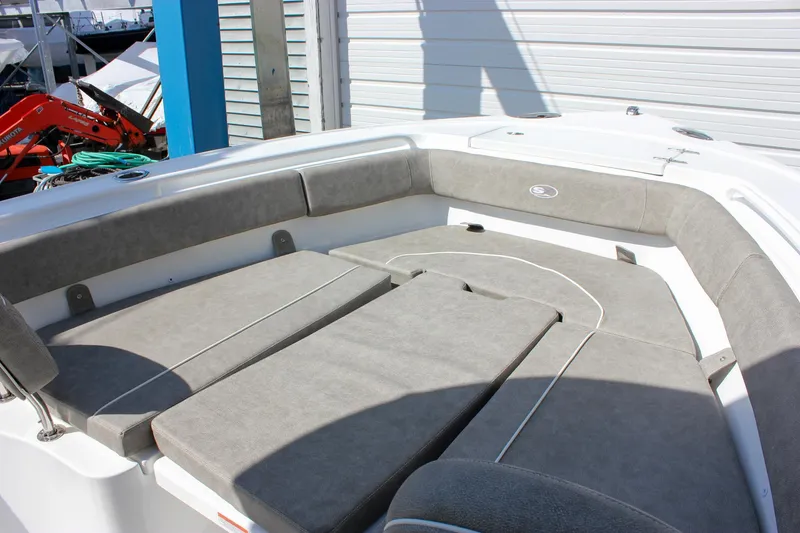 Slide: The Image of 2025 Sea Hunt Ultra 255 SE boat interior with cushioned seating. - 45