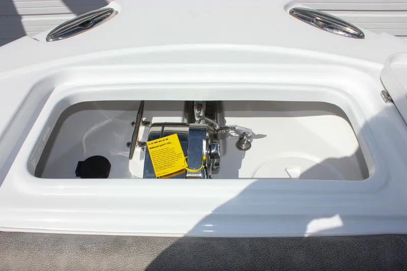Slide: The Image of Anchor compartment of 2025 Sea Hunt Ultra 255 SE boat, featuring a neatly organized setup. - 47